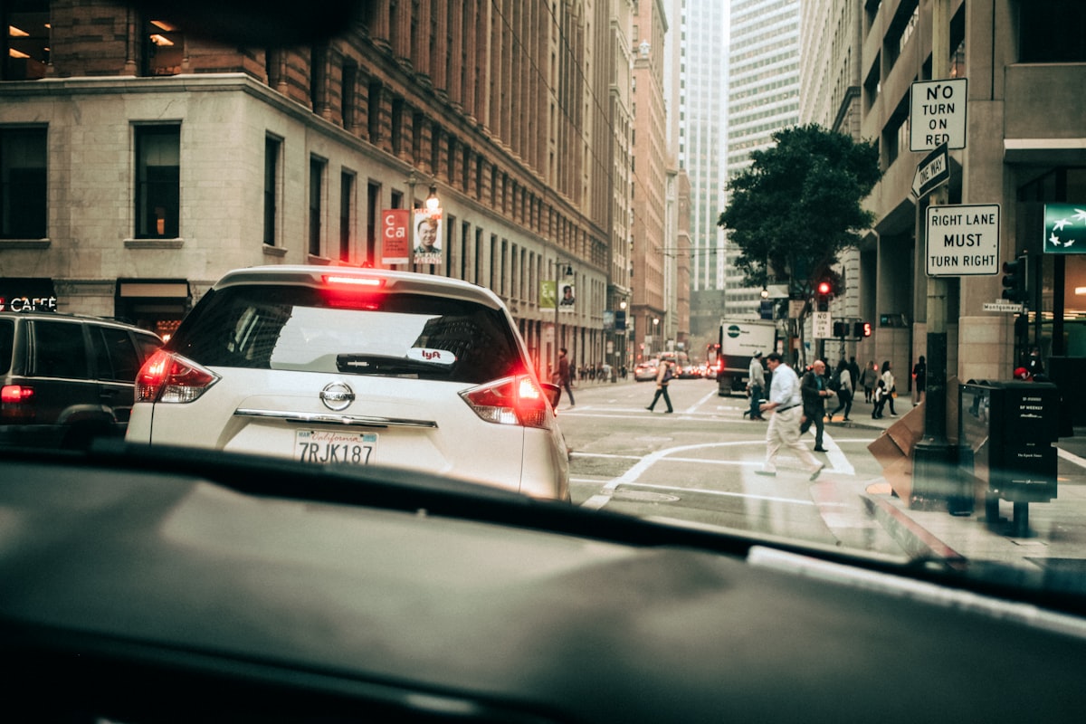 A white SUV on a San Francisco street, no identifiable people, brand, or logo, for the piece on Waymo's ridership growth and fleet math set against the safety edge cases that keep surfacing in the city